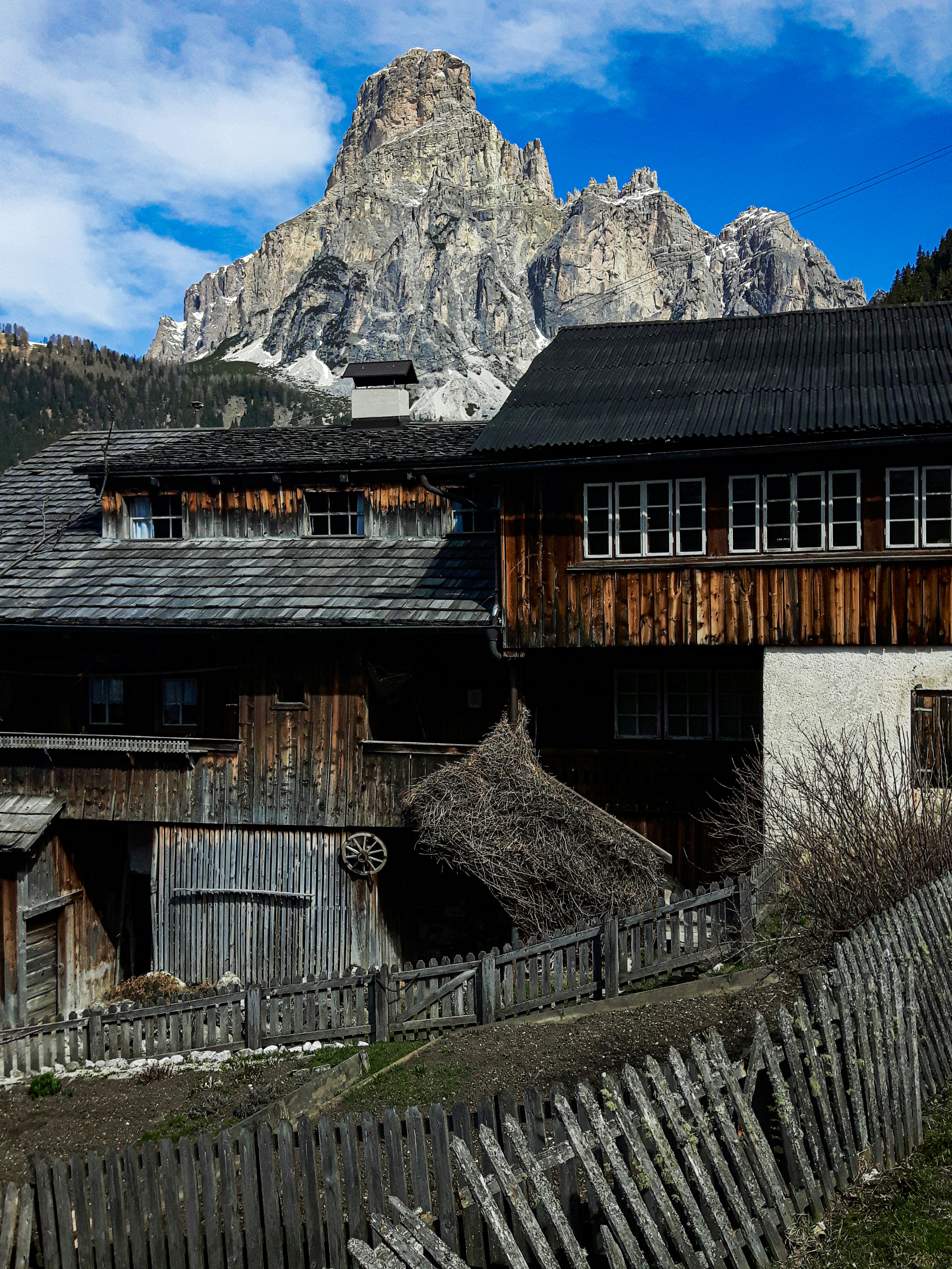 brown and black wooden house under blue sky during daytime